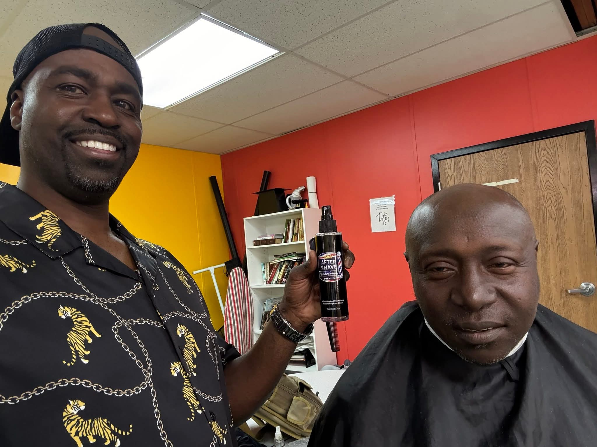 Barber giving a free haircut to a homeless man